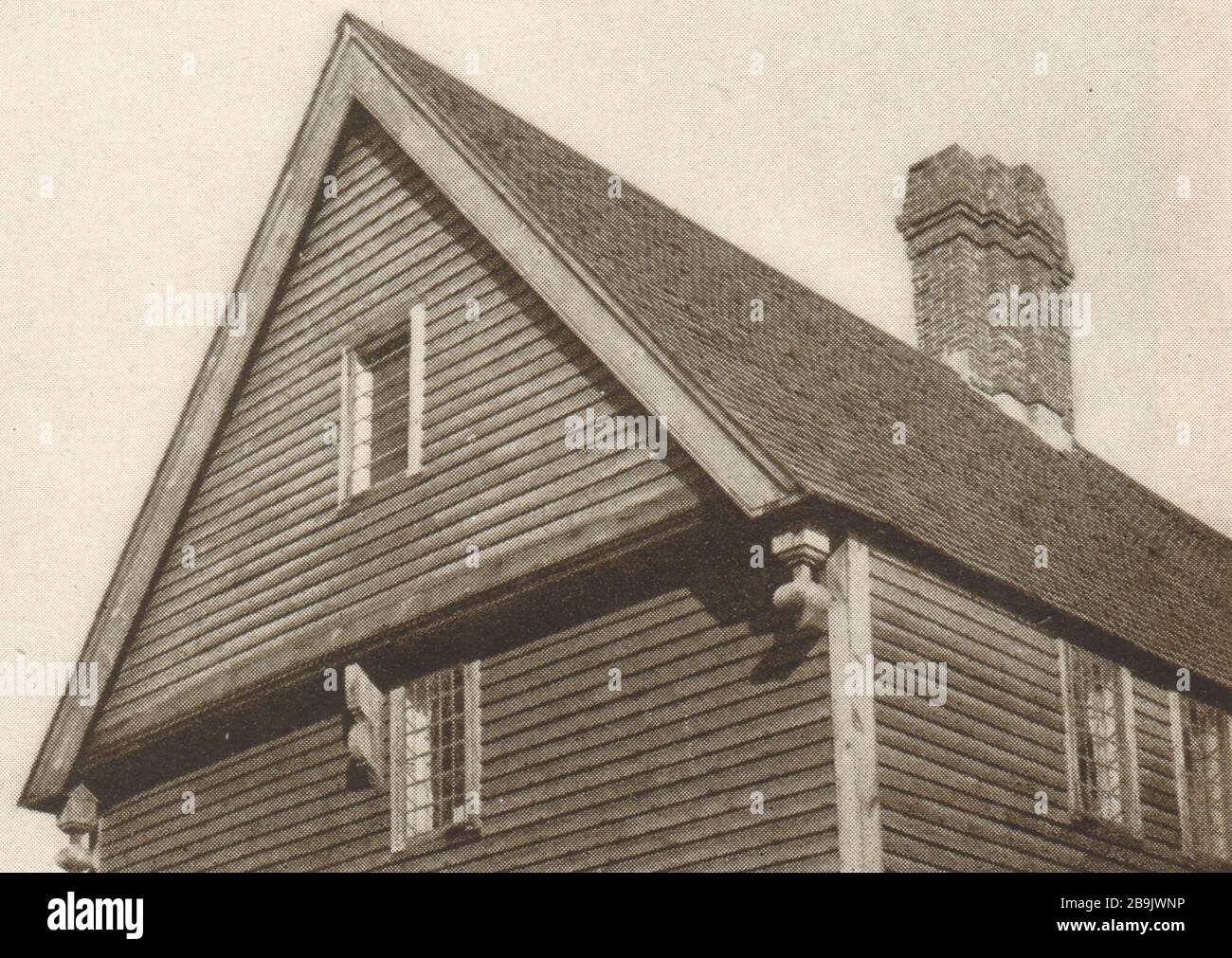 Overhanging gable end with chamfered end girt, bracket and drops, moulded verge board. (1922