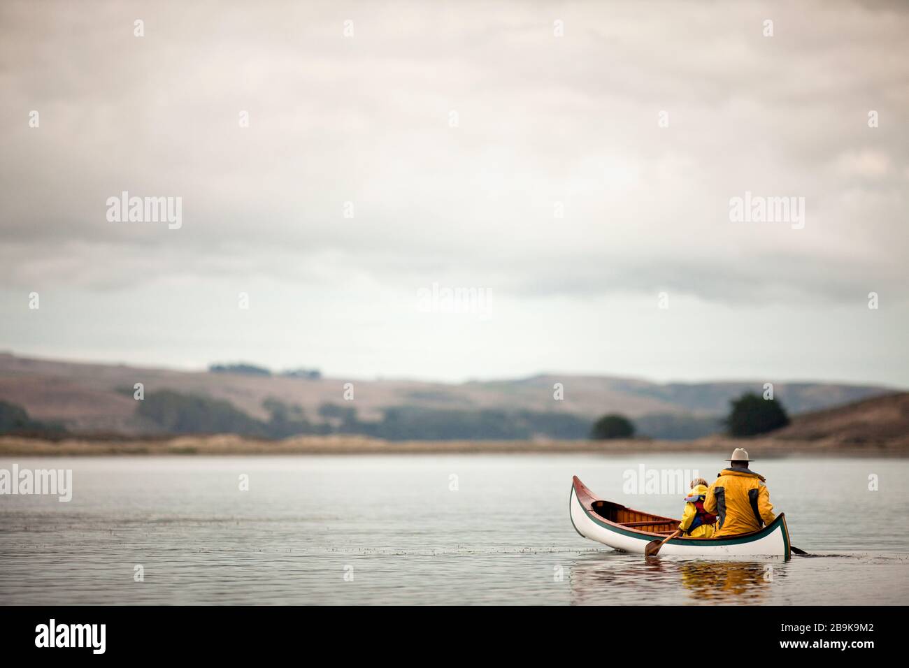 Man canoeing with his preschool age son. Stock Photo
