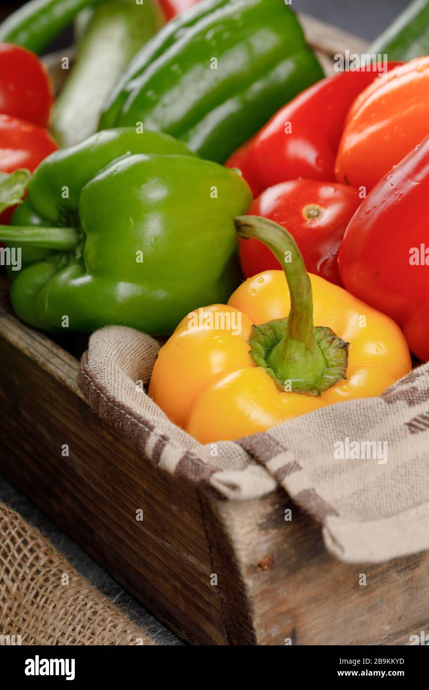 Bell peppers in a wooden rustic tray Stock Photo - Alamy