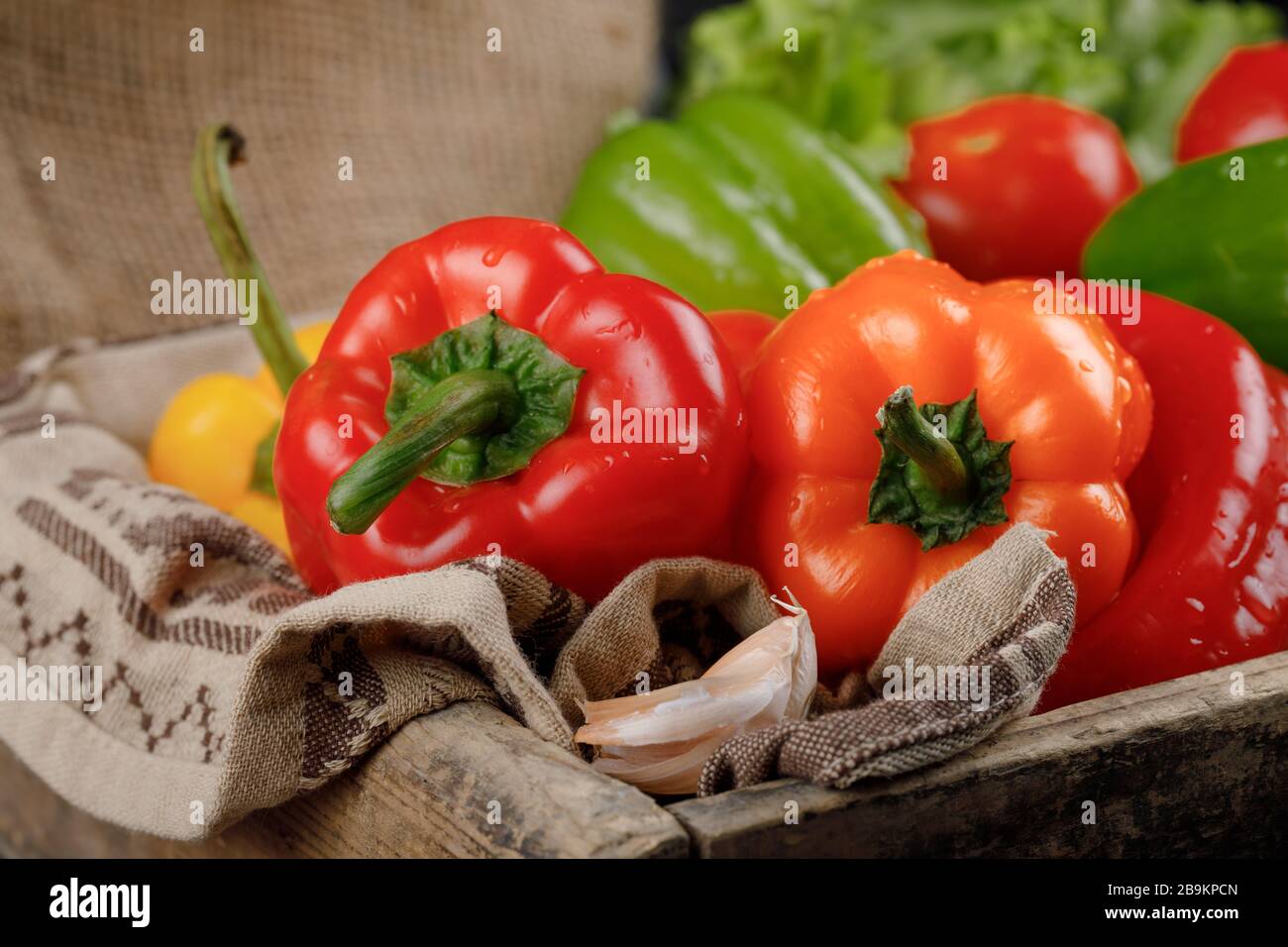 Red and orange color chili peppers in a wooden tray Stock Photo - Alamy