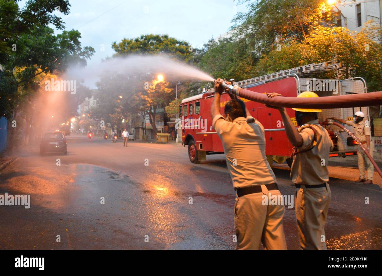 Bangalore, India. 24th Mar, 2020. Indian firemen spray disinfectant in Bangalore, India, March 24, 2020. The number of confirmed COVID-19 cases in India has reached 519, India's federal health ministry said Tuesday evening. Credit: Str/Xinhua/Alamy Live News Stock Photo