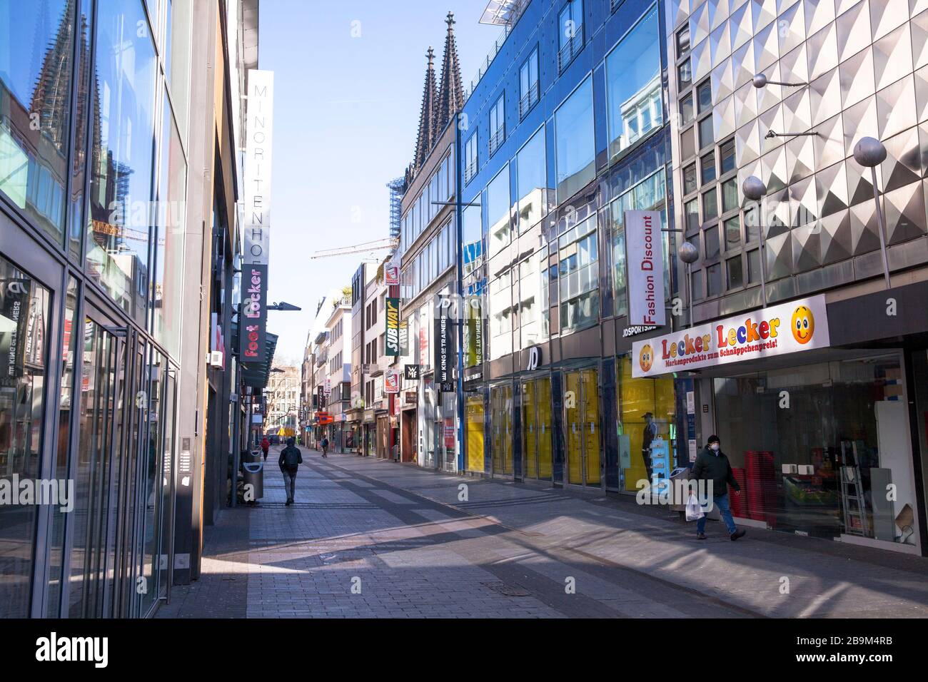 Coronavirus / Covid 19 outbreak, March 24th. 2020. Only few people on  shopping street Hohe Strasse, usually visited by thousands of people,  Cologne, G Stock Photo - Alamy