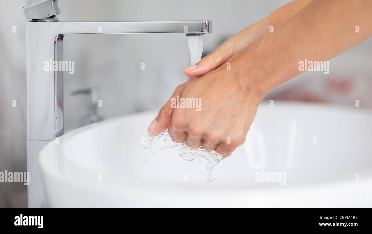 After toilet female washing hands using anti bacterial soap closeup Stock Photo