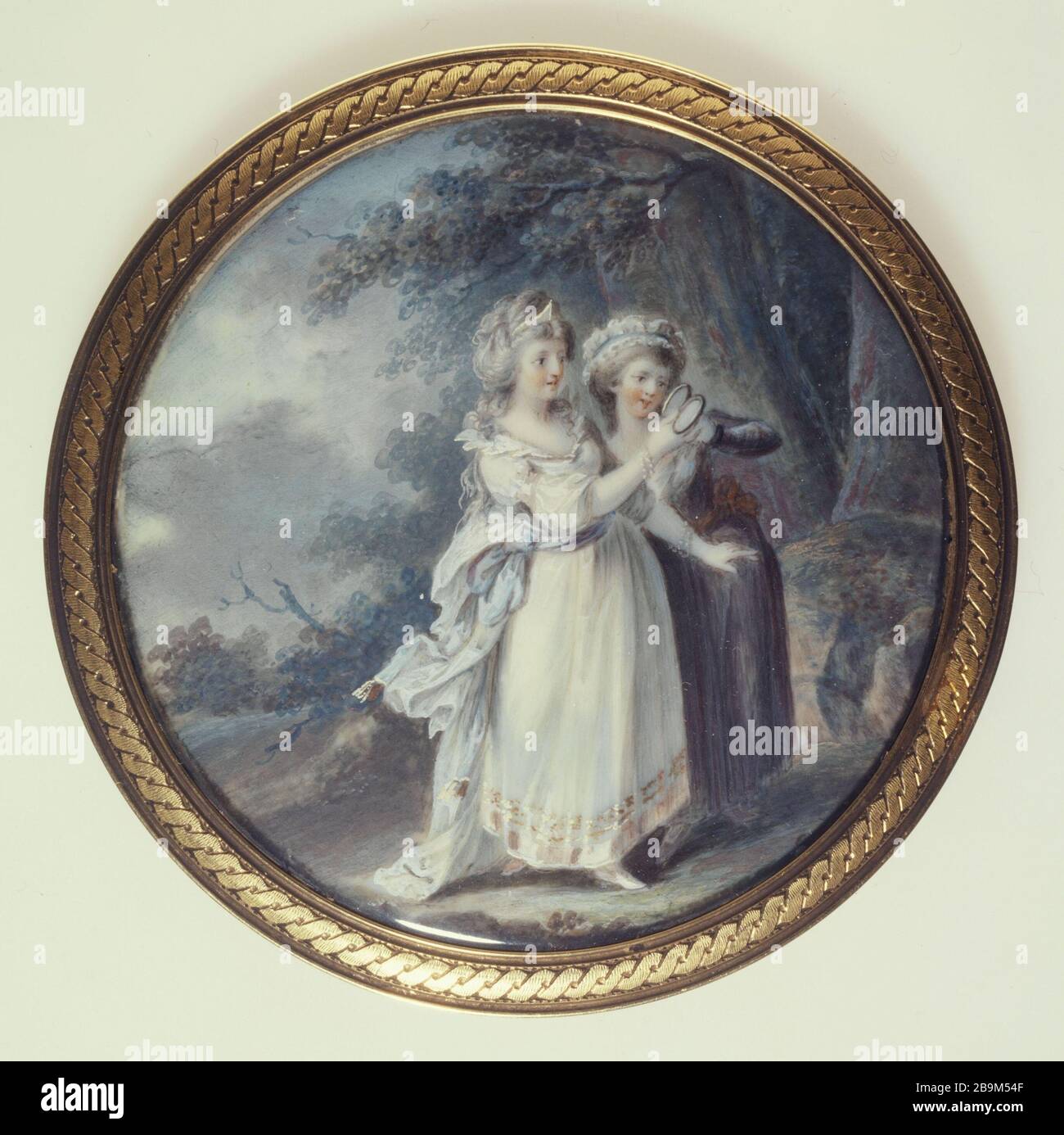 Two women in a park looking at a medallion Ecole française XVIIIème siècle. Deux femmes dans un parc regardant un médaillon. Aquarelle et gouache sur ivoire. Paris, musée Cognacq-Jay. Stock Photo