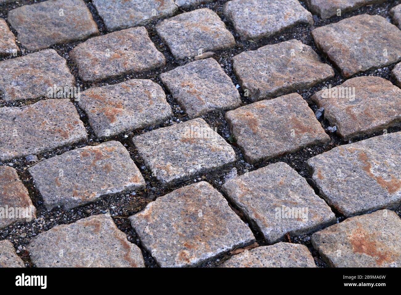 Abstract background of old cobblestone pavement close-up Stock Photo ...