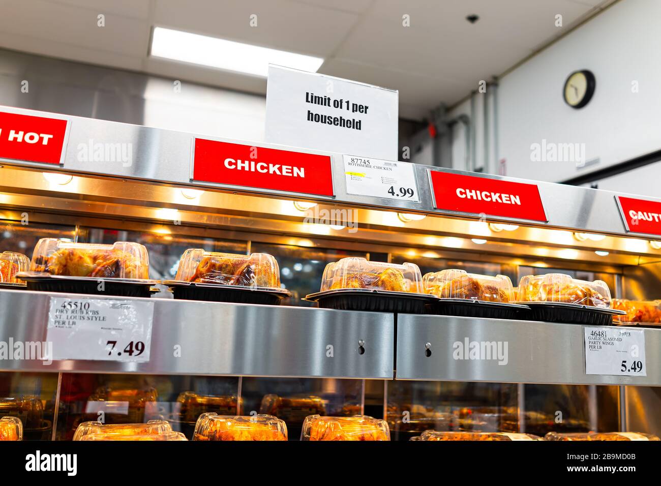 Sterling, USA - March 23, 2020: Costco club store during Coronavirus Covid-19 outbreak with sign for limit on rotisserie chicken inside building Stock Photo