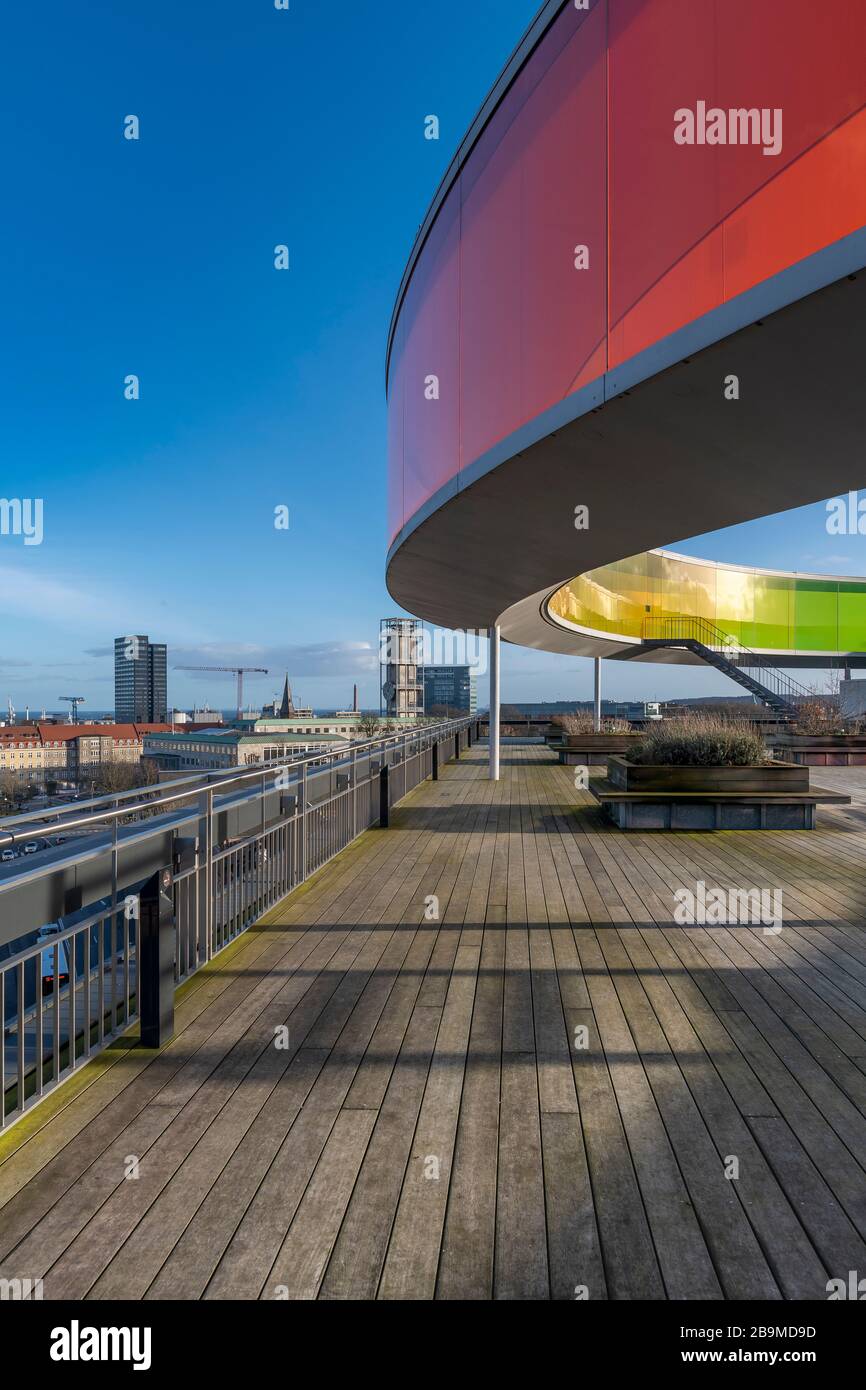 Your Rainbow Panorama by Olafur Elliasson sitting on top of the ARoS art  gallery in Aarhus in Denmark. Glass walls fade through rainbow colours  Stock Photo - Alamy