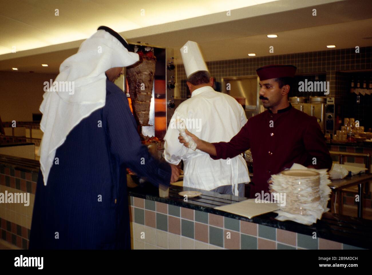 Kuwait City Kuwait Man Getting Food At University Canteen Stock Photo