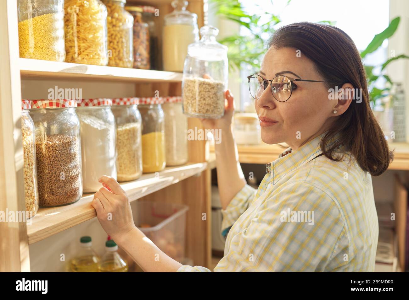 Food storage, wooden shelf in pantry with grain products in storage