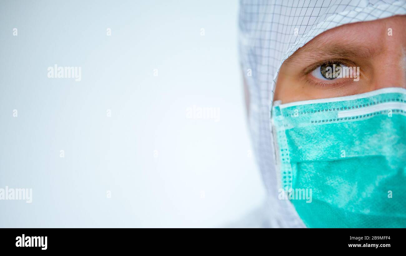Wearing surgical mask suit hi-res stock photography and images - Alamy