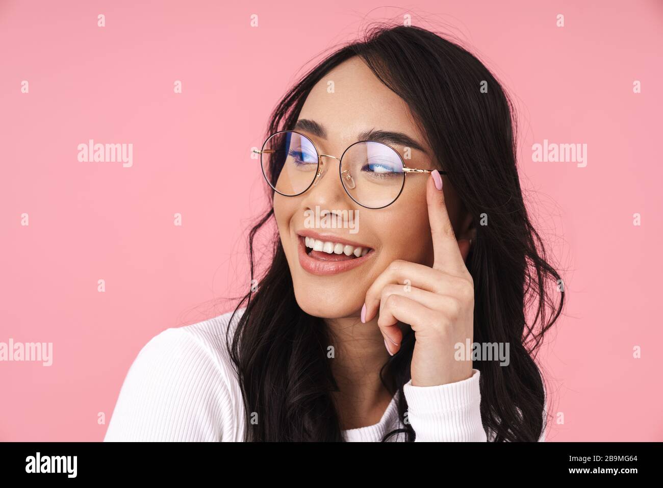 Image of young brunette asian woman wearing eyeglasses smiling and ...