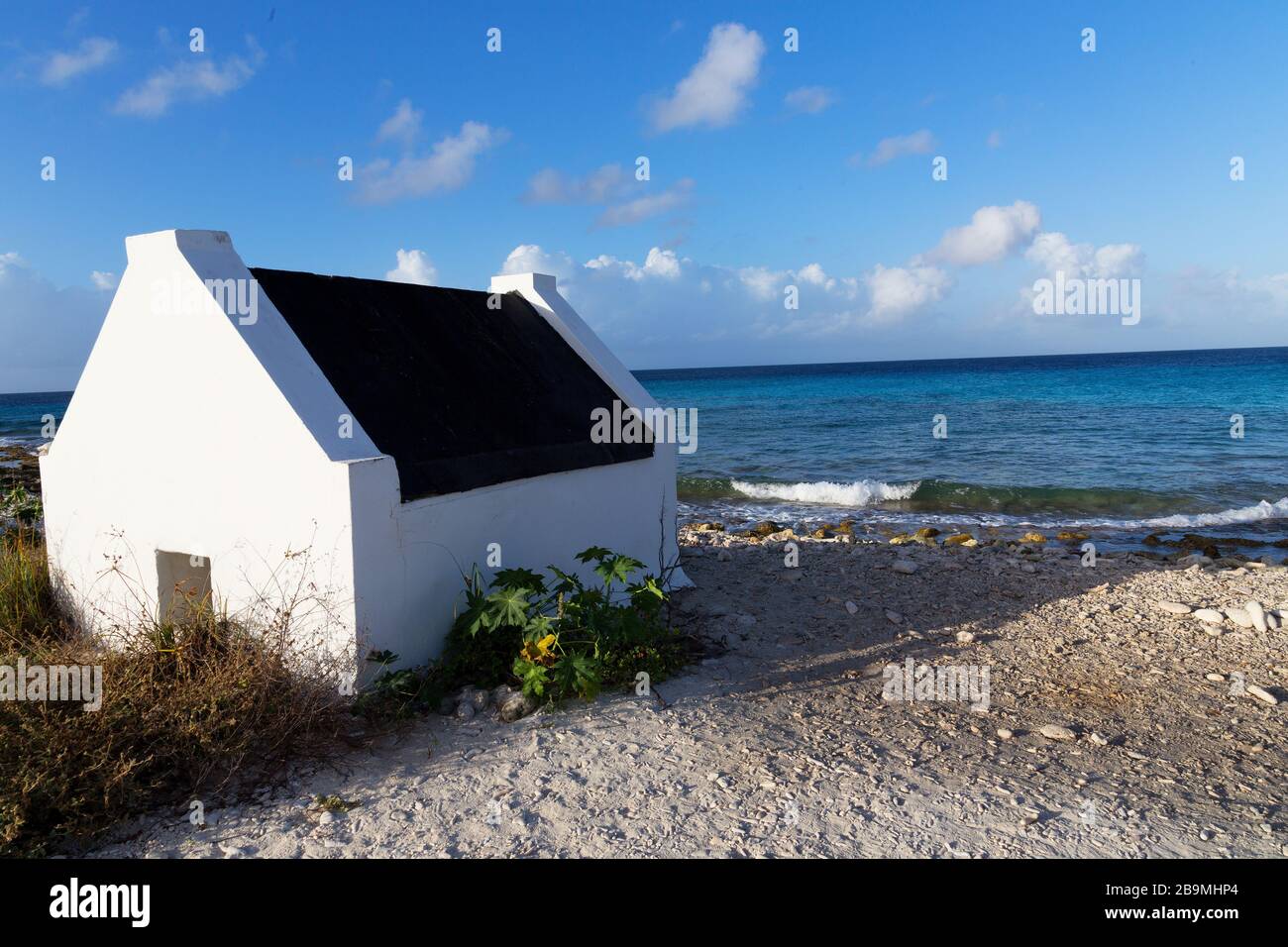 Historic white slave huts on the coast of Bonaire, of the ABC Islands Dutch Antillies, Carbbean Sea Stock Photo