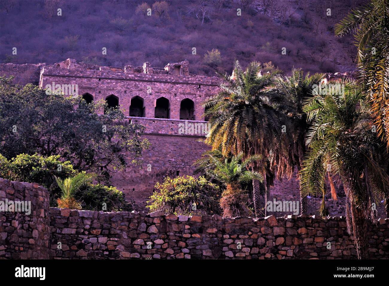 Awesome pinkish  view of ruined nahargarh fort with mighty hills in backdrop located in Jaipur, Rajasthan, India Stock Photo