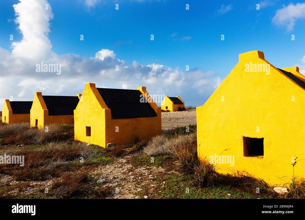 Historic orange slave huts on the coast of Bonaire, of the ABC Islands Dutch Antillies, Carbbean Sea Stock Photo