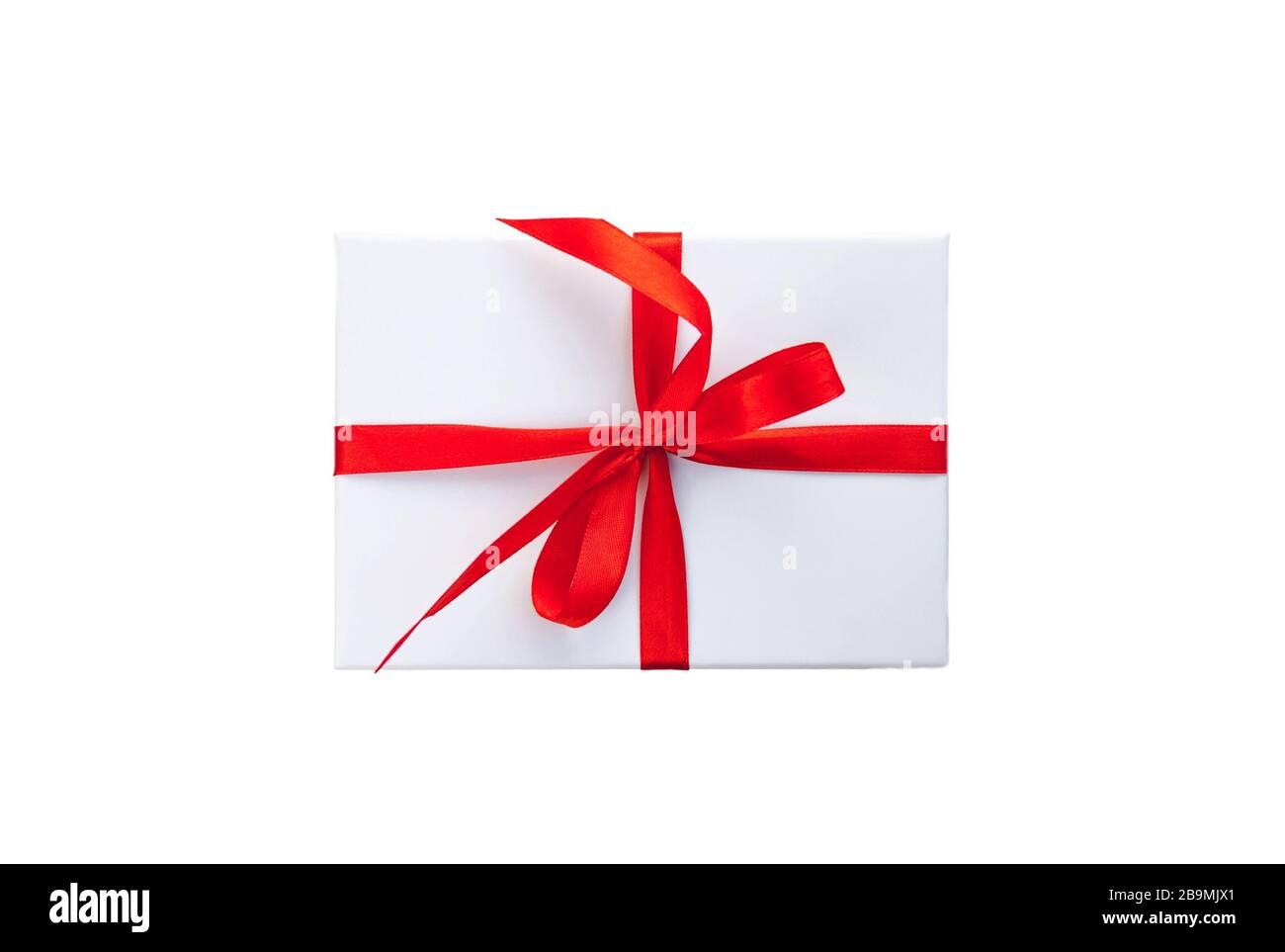 White gift box with red ribbon and bow isolated on white background top ...