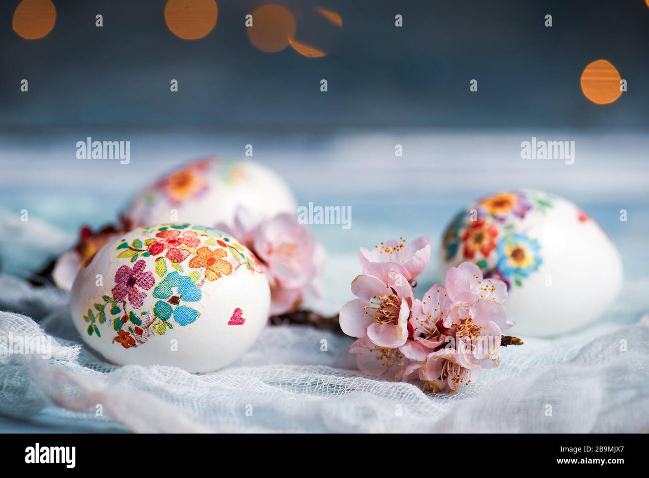 Decoupage decorated Easter eggs with cherry blossom flowers Stock Photo