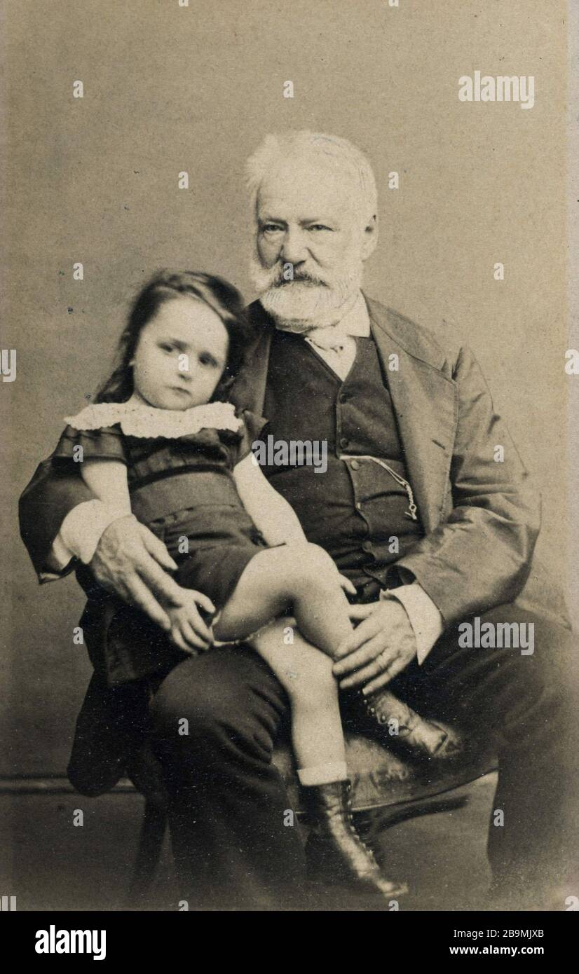 Victor Hugo and his granddaughter Jeanne sitting on his lap Victor Hugo et  sa petite-fille Jeanne assise sur ses genoux. 1872-1873. Epreuve sur papier  albuminé. Photographie d'Arsène Garnier (1822-1900). Paris, Maisons de