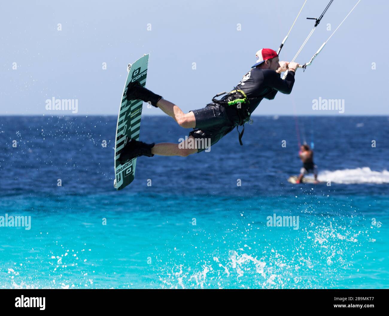 Winds power kite boarding in the blue waters of Bonaire, Netherlands Antillies, Caribbean Stock Photo