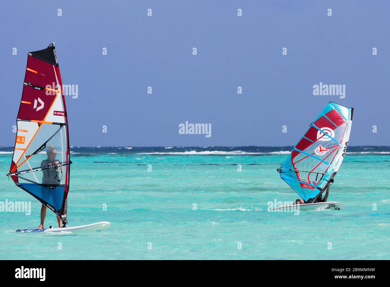 Winds power wind surfing in the blue waters of Bonaire, Netherlands Antillies, Caribbean Stock Photo