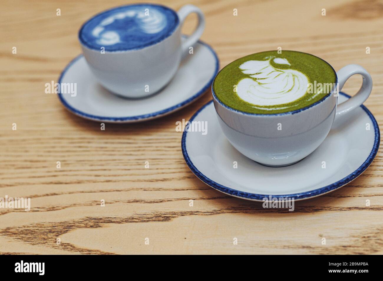 Breakfast Is A Couple Of People The Right Snack For A Cup Of Coffee Match With Milk Two Cups Of Blue And Green Matches With A Heart Pattern Blog Template Stock Photo