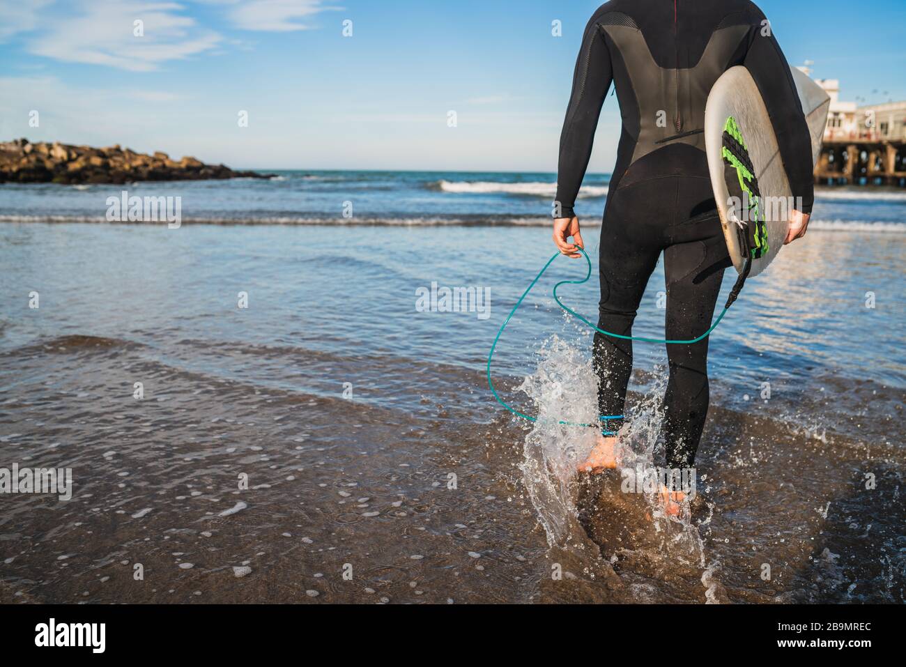 Surfer with black suit hi-res stock photography and images - Alamy