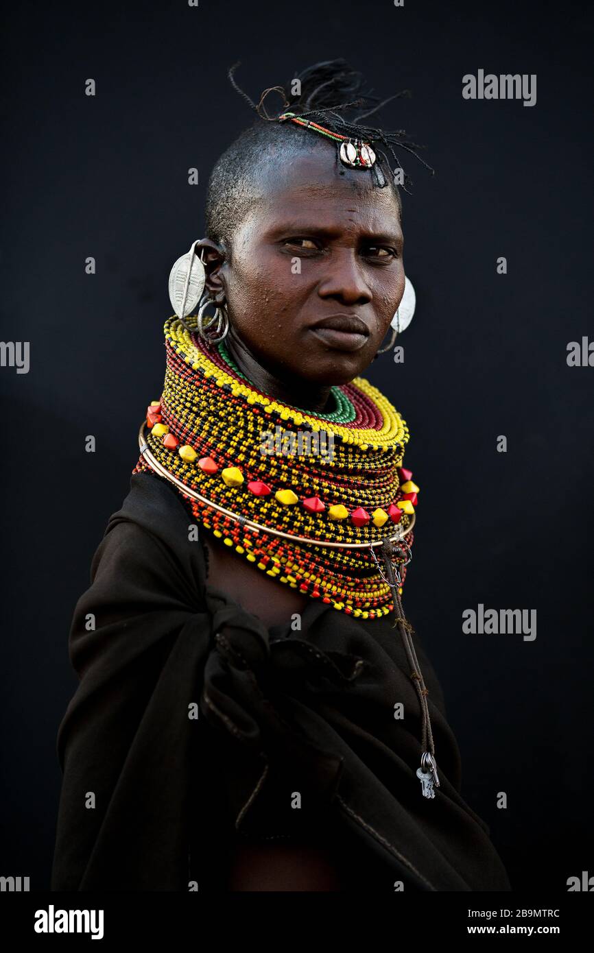 A married young Turkana woman in traditional attire at her village near Loiyangalani, Kenya. Stock Photo