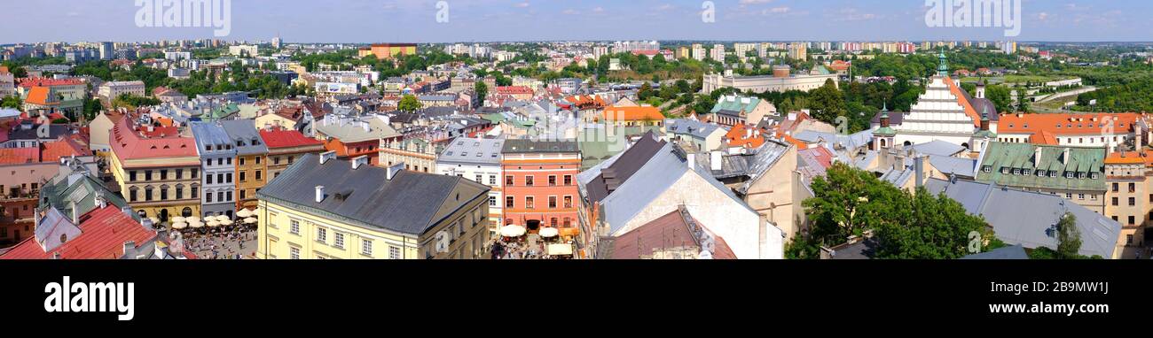 Lublin, Lubelskie / Poland - 2019/08/18: Panoramic view of old town quarter with market square and historic XVI century High Royal Court building Stock Photo