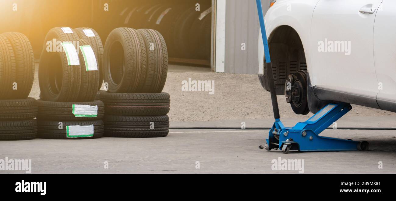 Seasonal tire change at a tire shop service Stock Photo