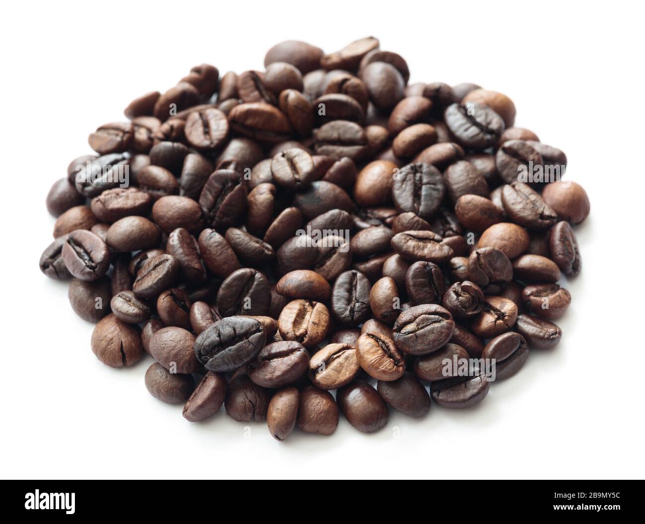 Round heap of roasted coffee beans top view isolated on white ...