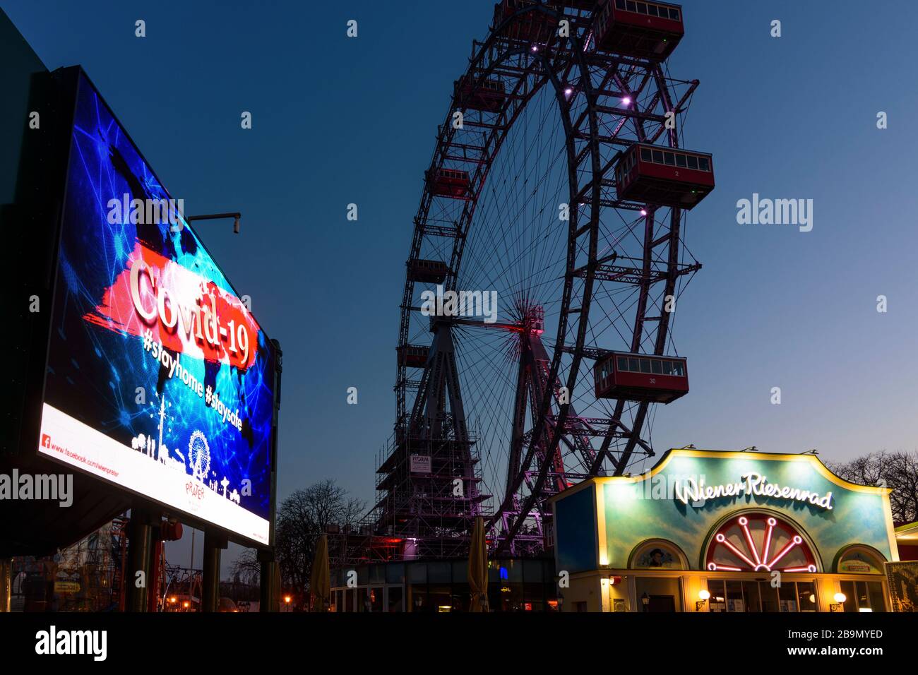 Wien, Vienna: information video wall with COVID-19 warning, Ferris Wheel at Prater closed due to corona virus (COVID-19), in 02. Leopoldstadt, Wien, A Stock Photo