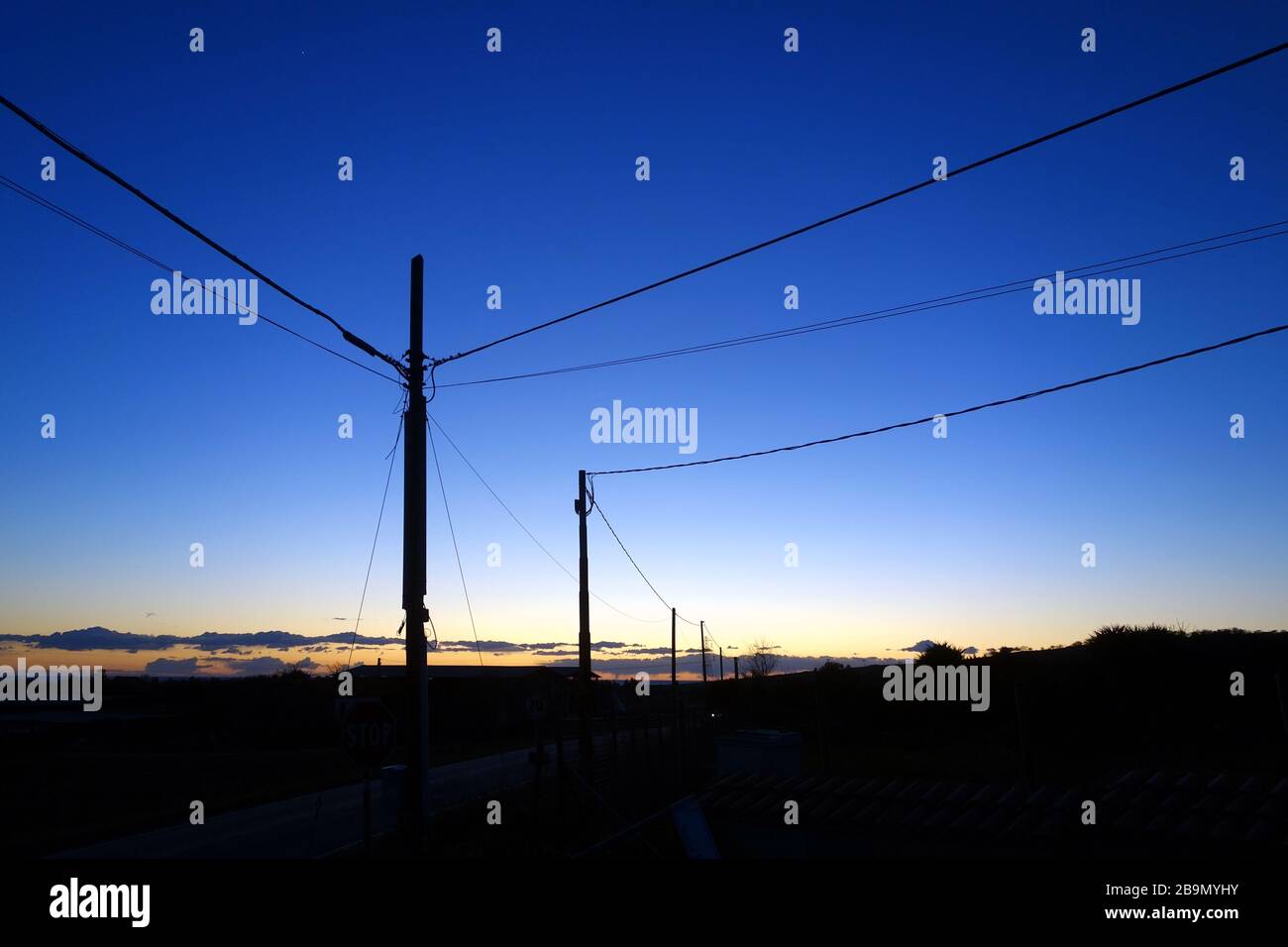 Power Pylon silhouette against Sunset sky Stock Photo - Alamy