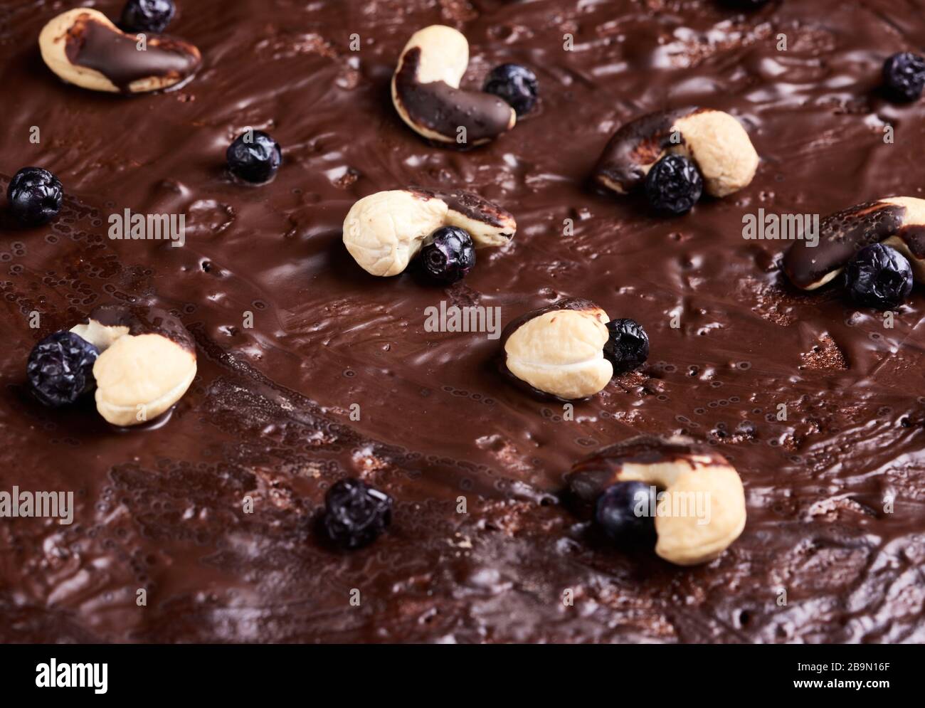 texture of baked brownie chocolate cake with chocolate poured. Cooked homemade food. Chocolate pastry. Sweet meal, homemade dessert Stock Photo