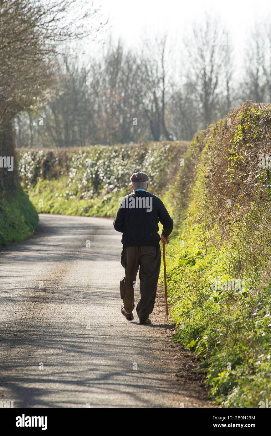 Man walking country lane hi-res stock photography and images - Alamy