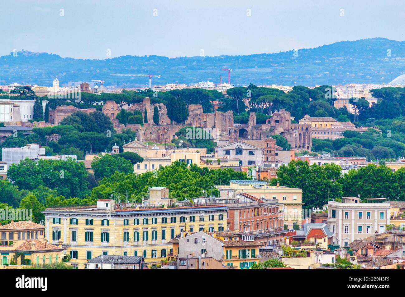 Scenic view of historic Rome city seen through the trees in Parco del ...