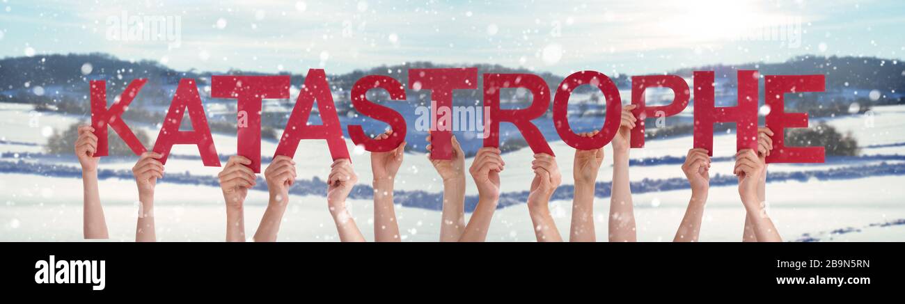 People Hands Holding Word Katastrophe Means Catastrophe, Snowy Winter Background Stock Photo