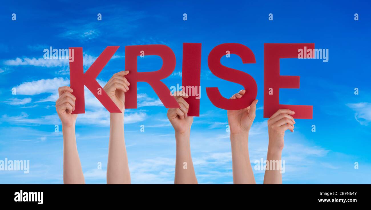 People Hands Holding Word Krise Means Crisis, Blue Sky Stock Photo