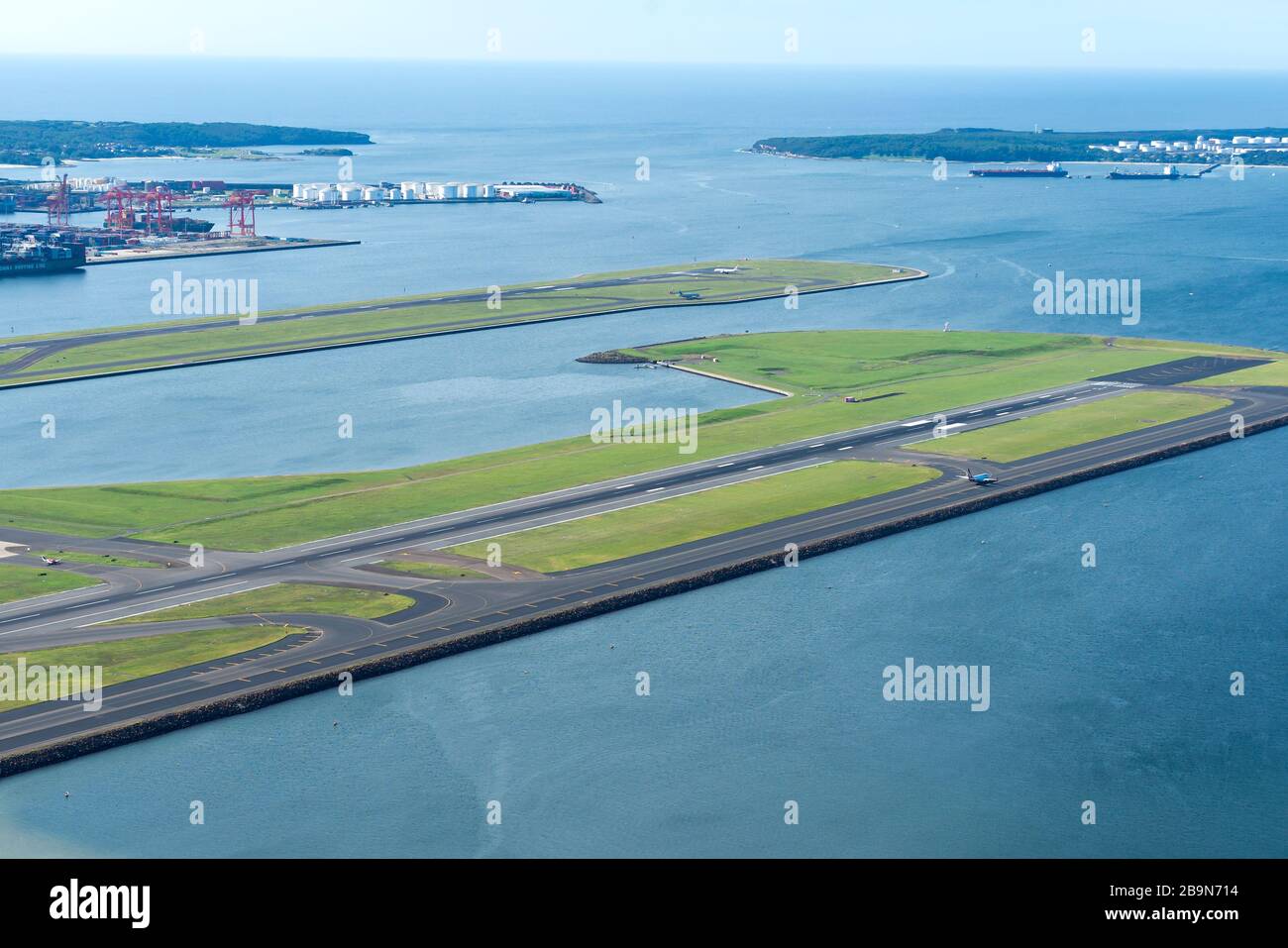 Airport runway built in reclaimed terrain at Sydney Kingsford Smith International Airport (SYD / YSSY), Australia. Reclaimed area in Botany Bay. Stock Photo