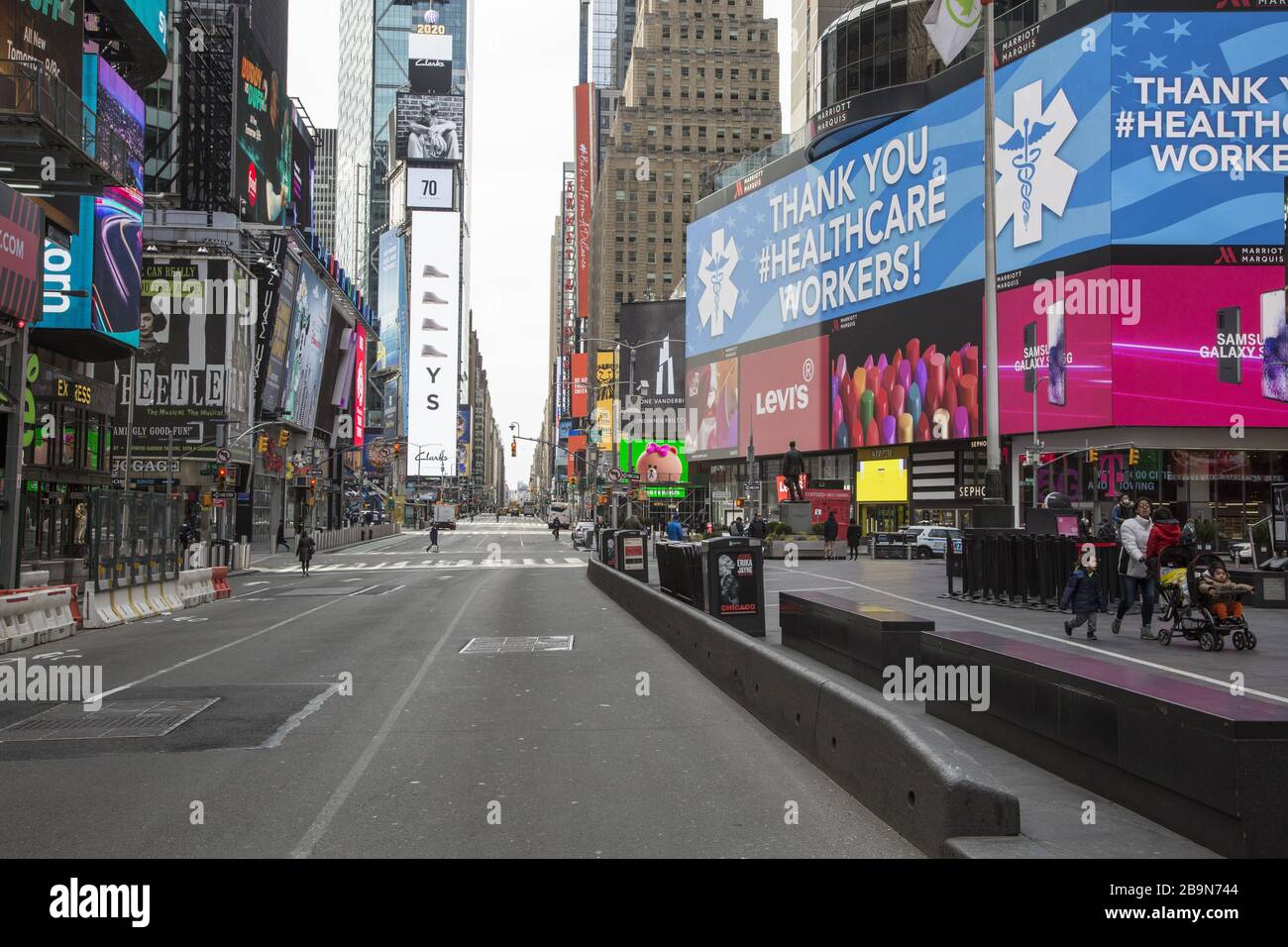 Times Square is virtually empty of tourists and New Yorkers due to the Coronavirus and the state lockdown in New York. Stock Photo