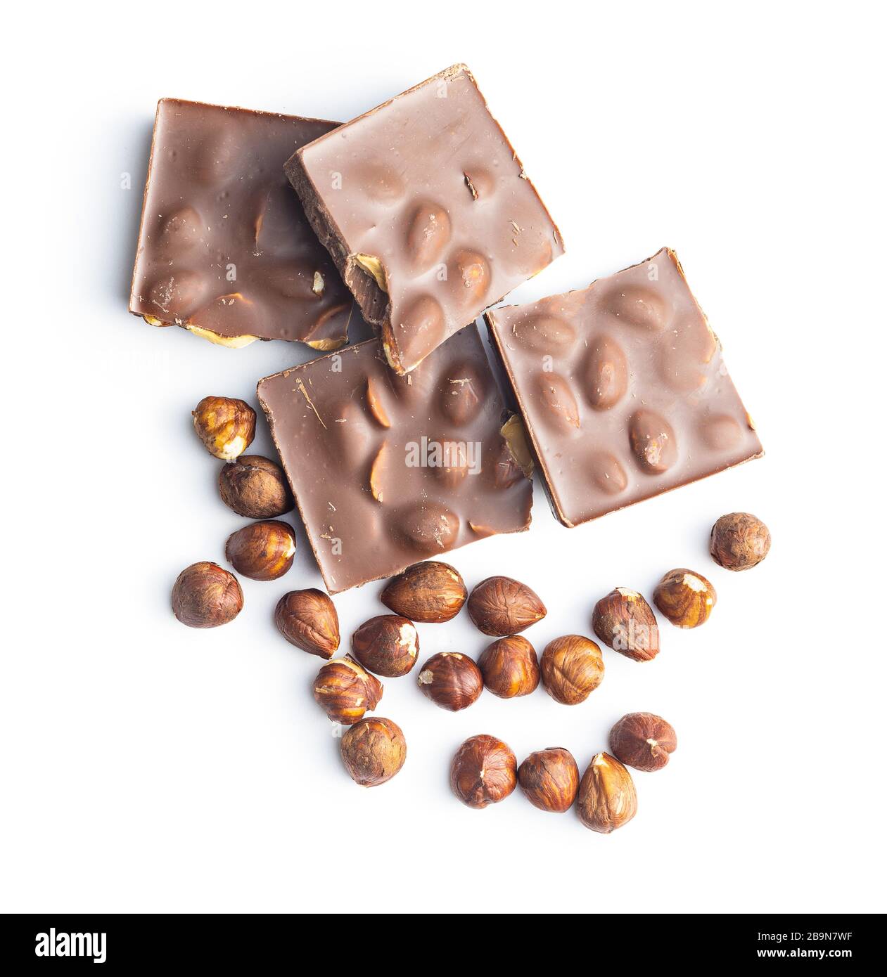 Chocolate bar and hazelnuts isolated on white background. Stock Photo