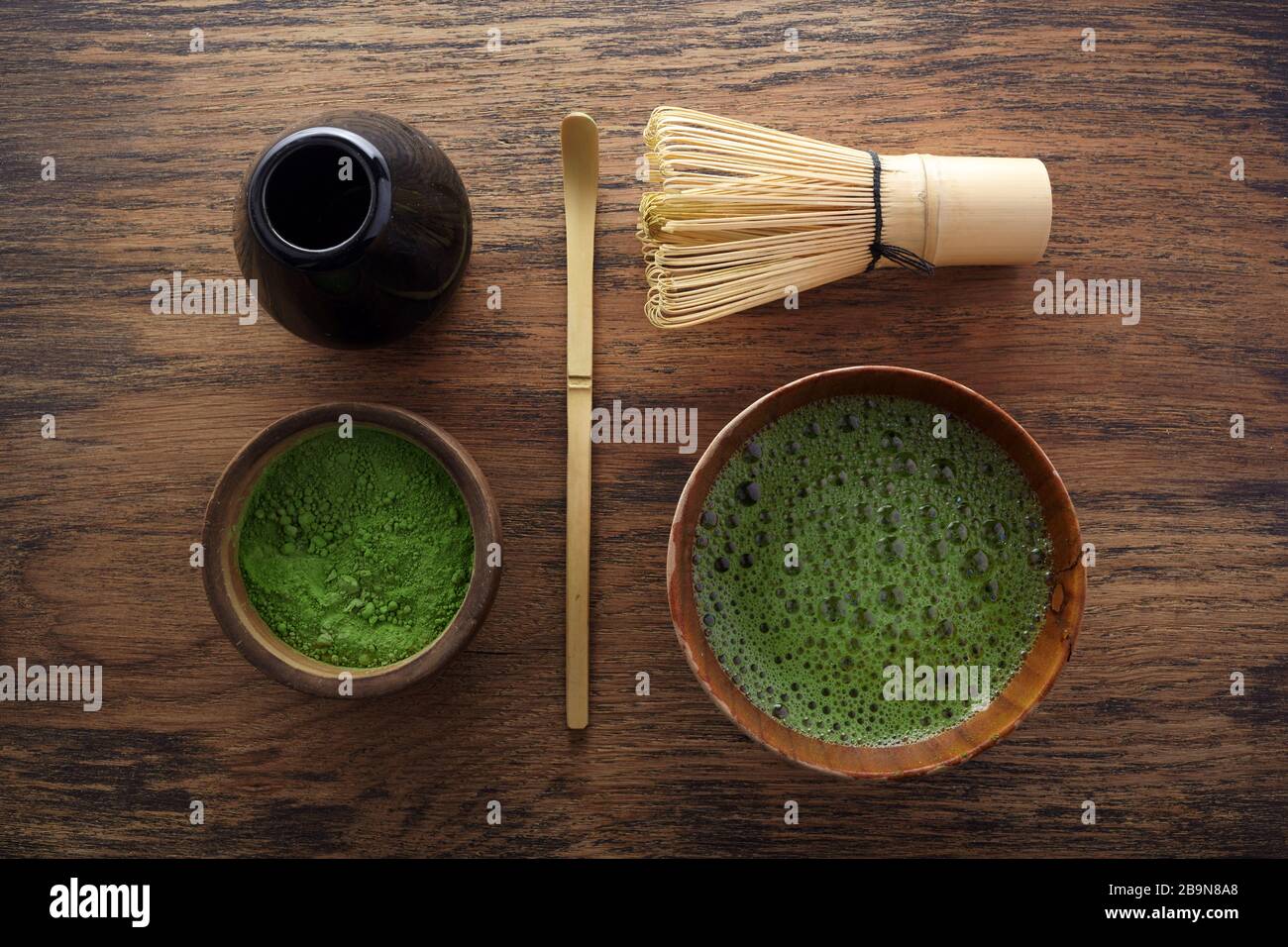 Set with green matcha tea on wooden background. Japanese tea ceremony