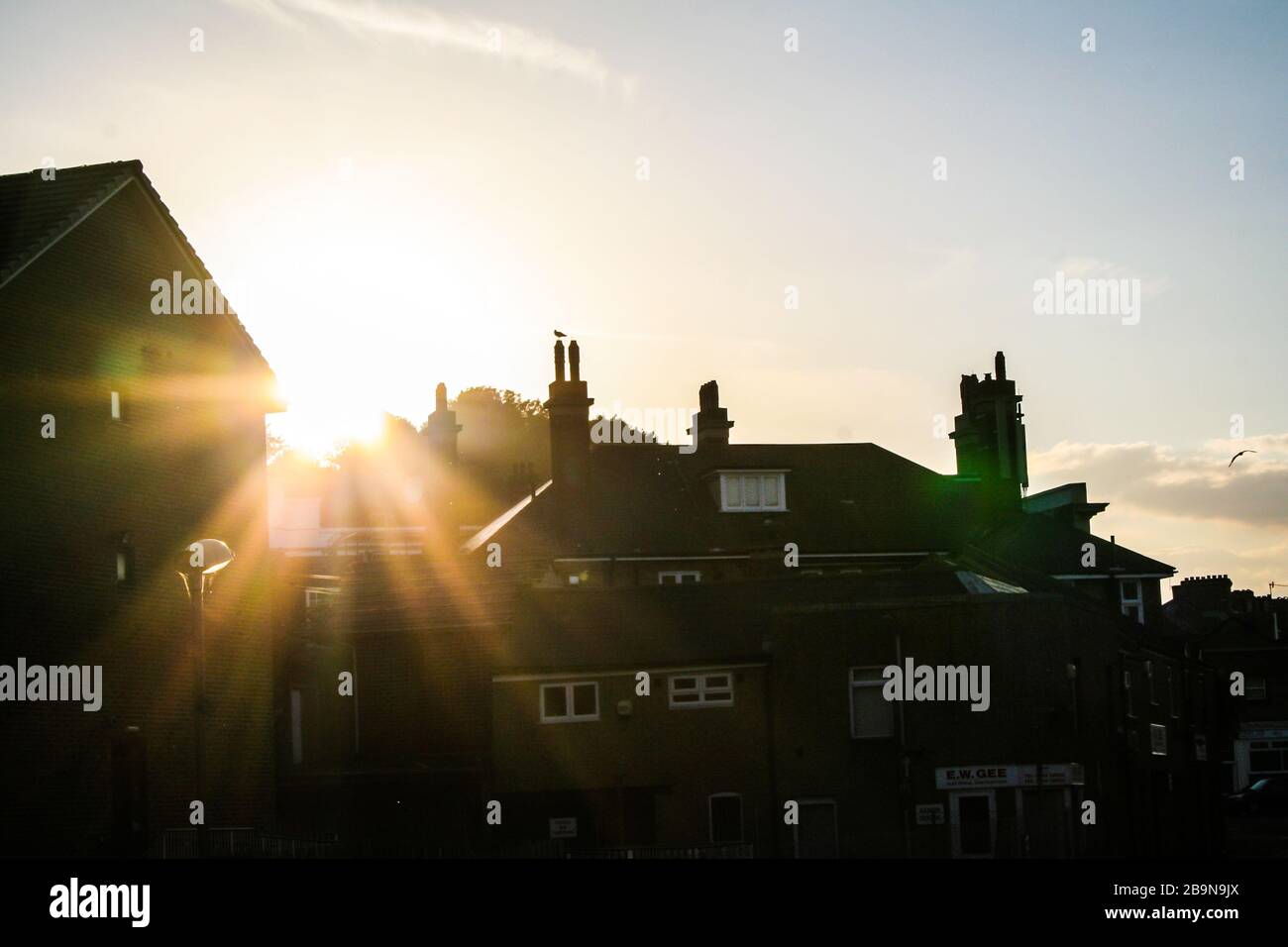 Sunset in Dover. Backlight of roofs and chimeneys Stock Photo