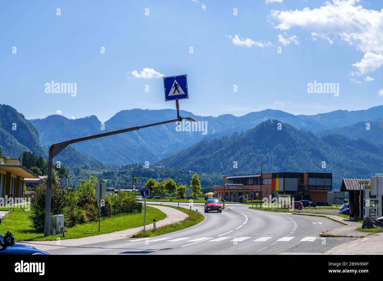 Carinthia, Austria - August 09, 2019: Road in countryside with Alpine hills in Carinthia, Austria Stock Photo