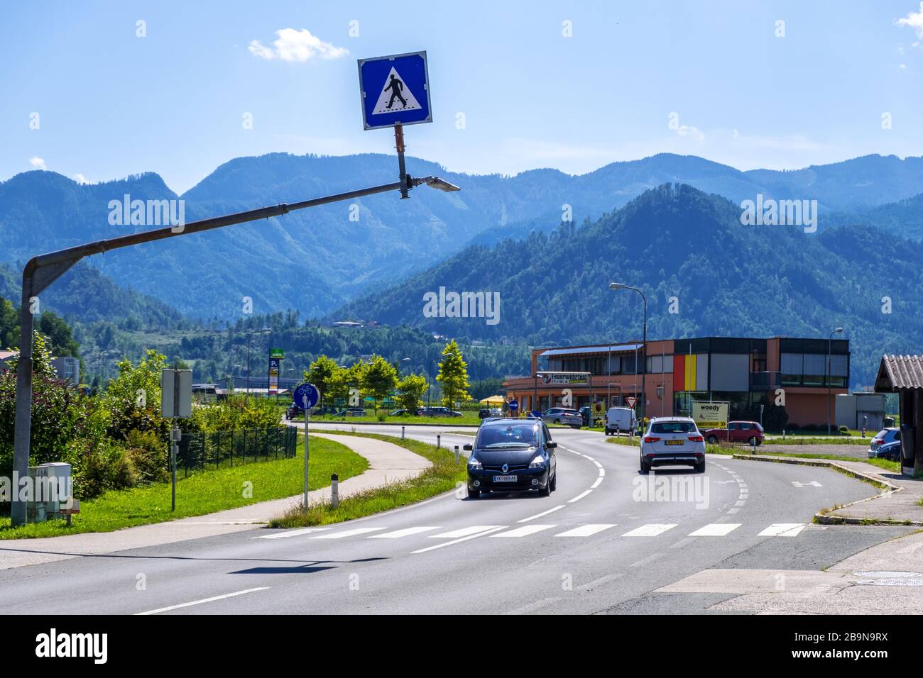 Carinthia, Austria - August 09, 2019: Road in countryside with Alpine hills in Carinthia, Austria Stock Photo