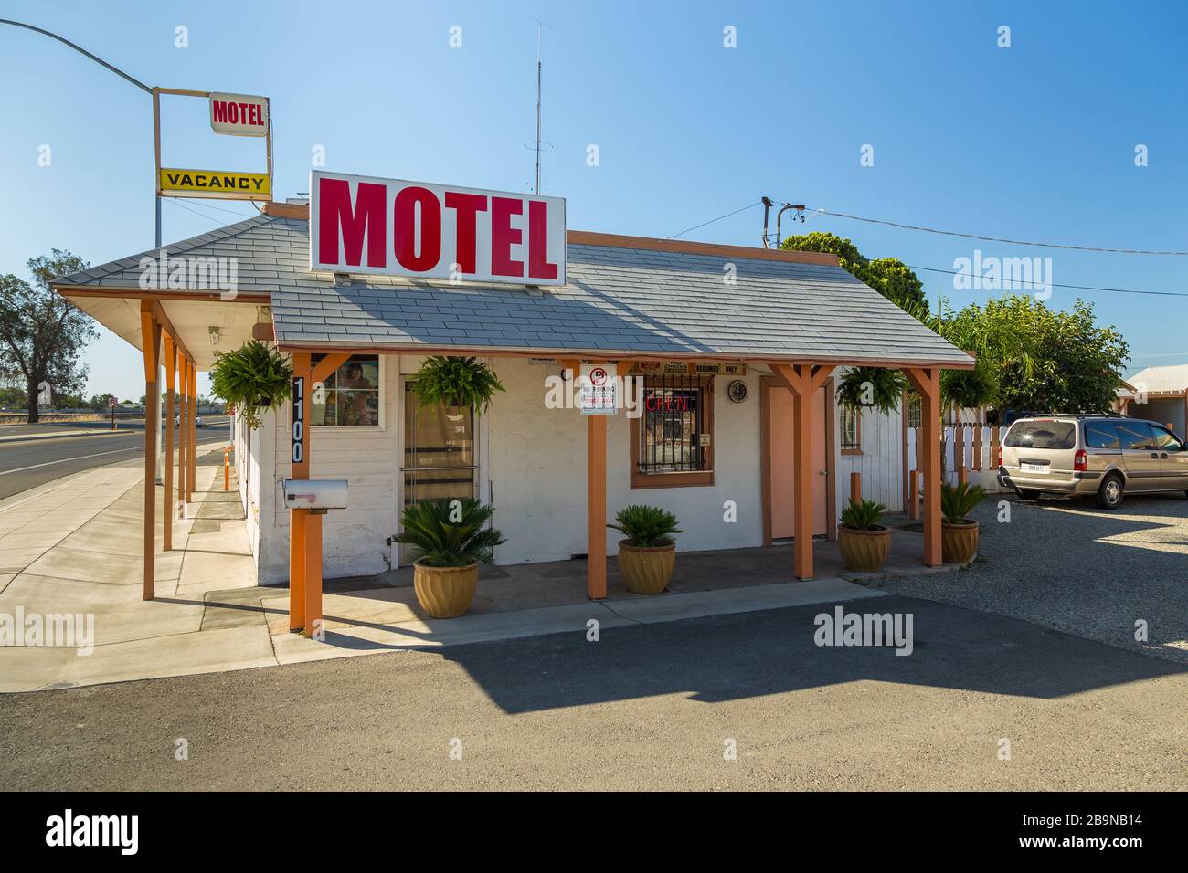 Madera, California, USA - 07 June 2015: View of the motel. Small, white building in the suburban area. Stock Photo