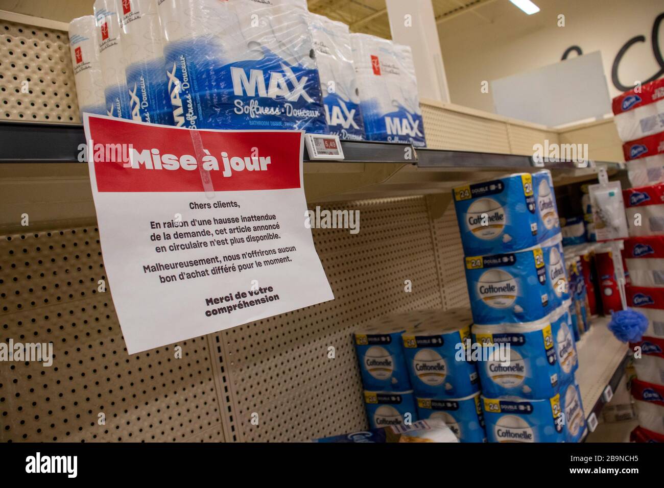 March 23, 2020 - Montreal, Qc,Canada : Low stock and empty toilet tissue paper shelves at supermarket, Coronavirus (COVID-19) Pandemic Crisis, Provigo Stock Photo