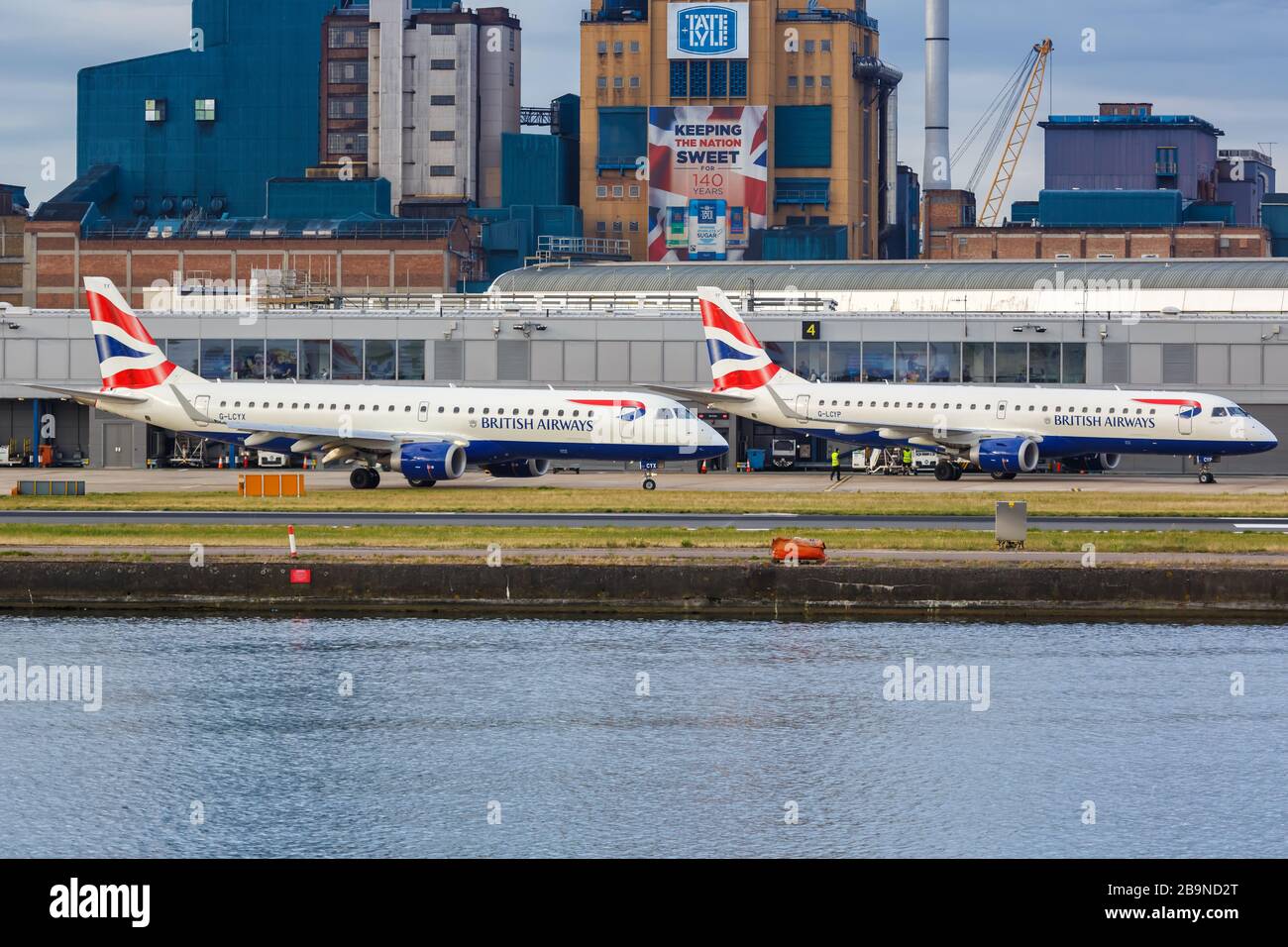 London, United Kingdom – July 8, 2019: British Airways BA CityFlyer Embraer 190 airplanes at London City airport (LCY) in the United Kingdom. Stock Photo