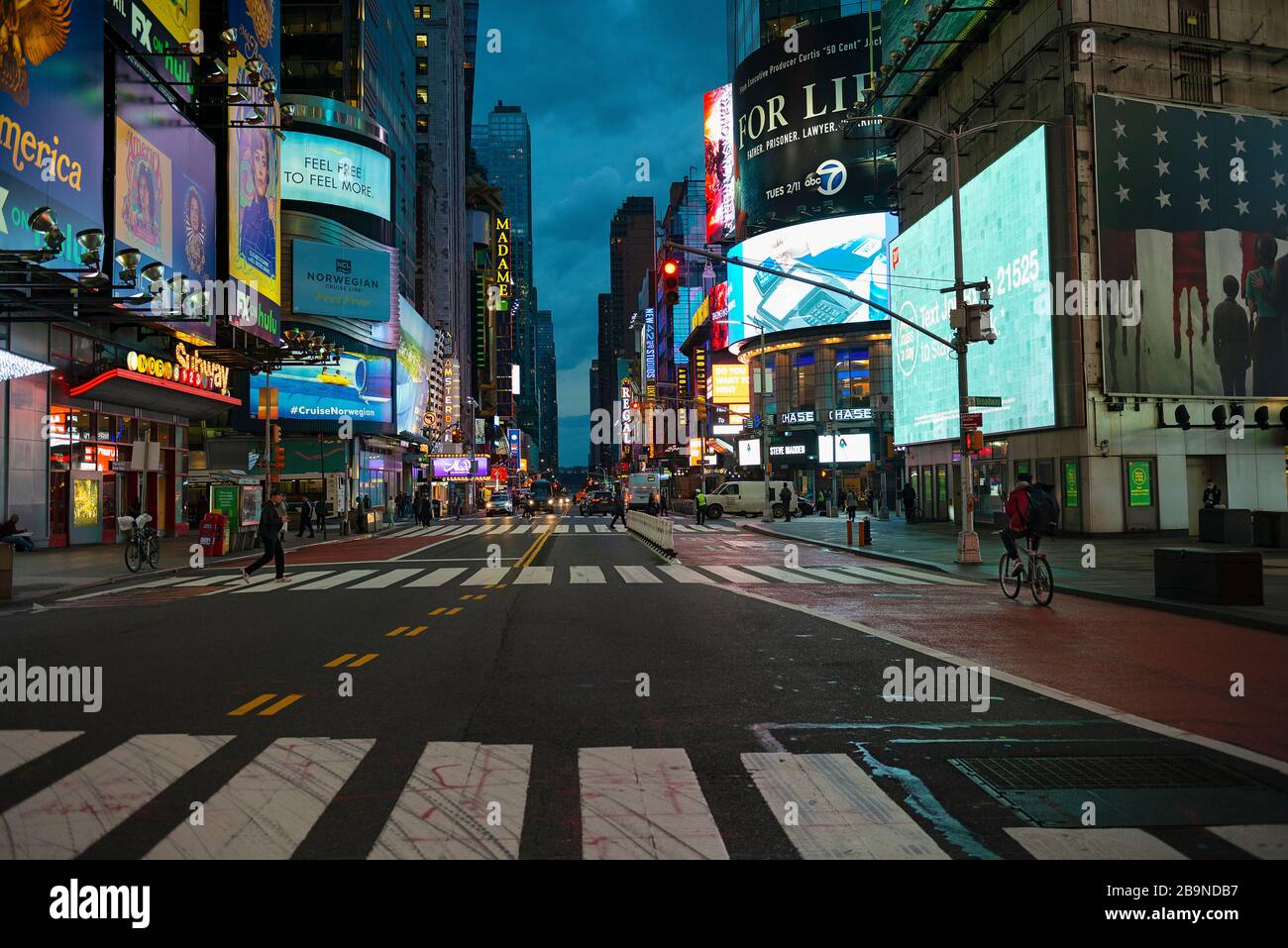 42nd Street in Times Square on March 20th, at 6:15 pm during what should be rush hour during the Covid-19 Coronavirus outbreak in New York City, Stock Photo