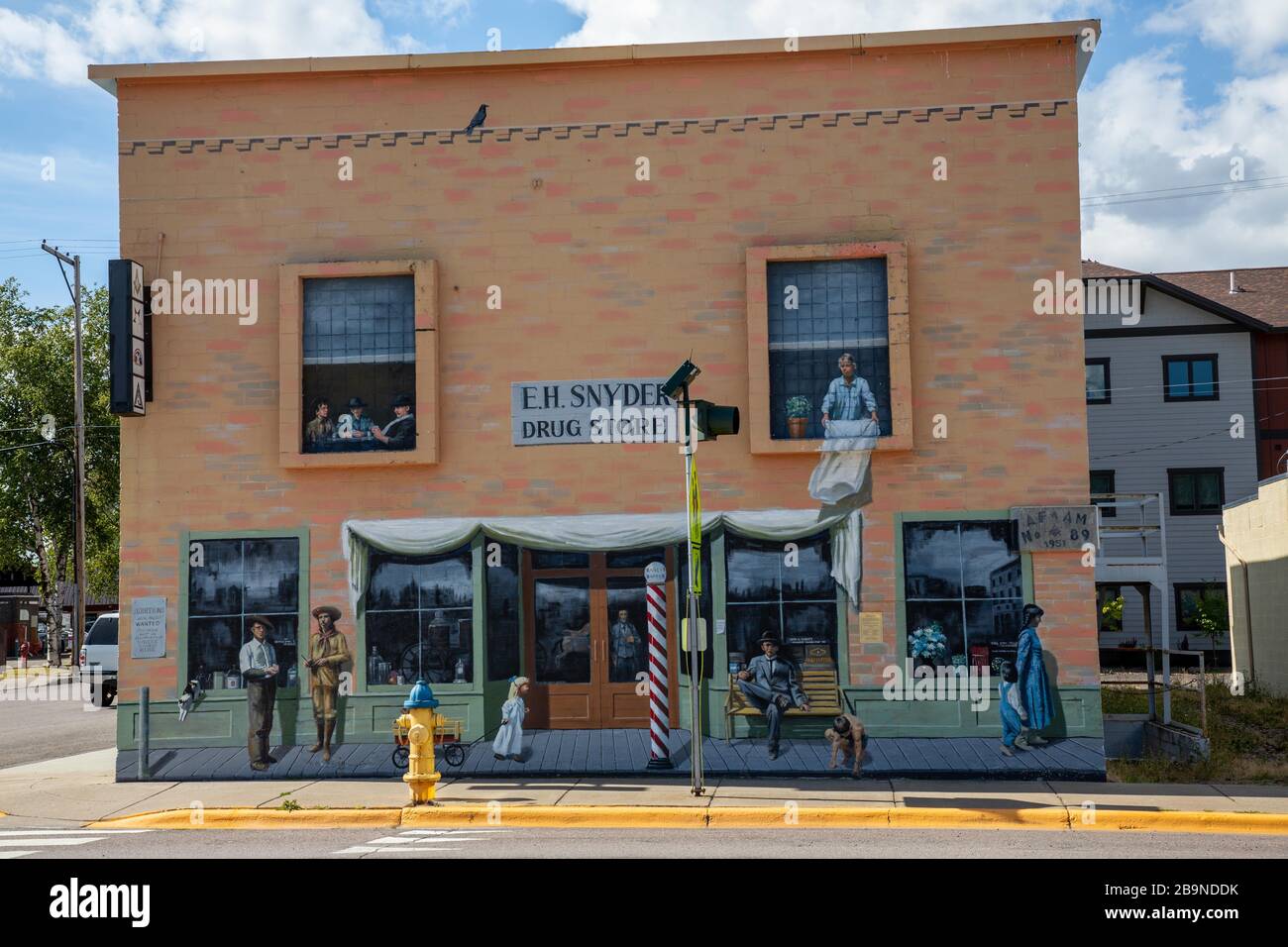 Painted facade of a building to resemble windows and people Stock Photo