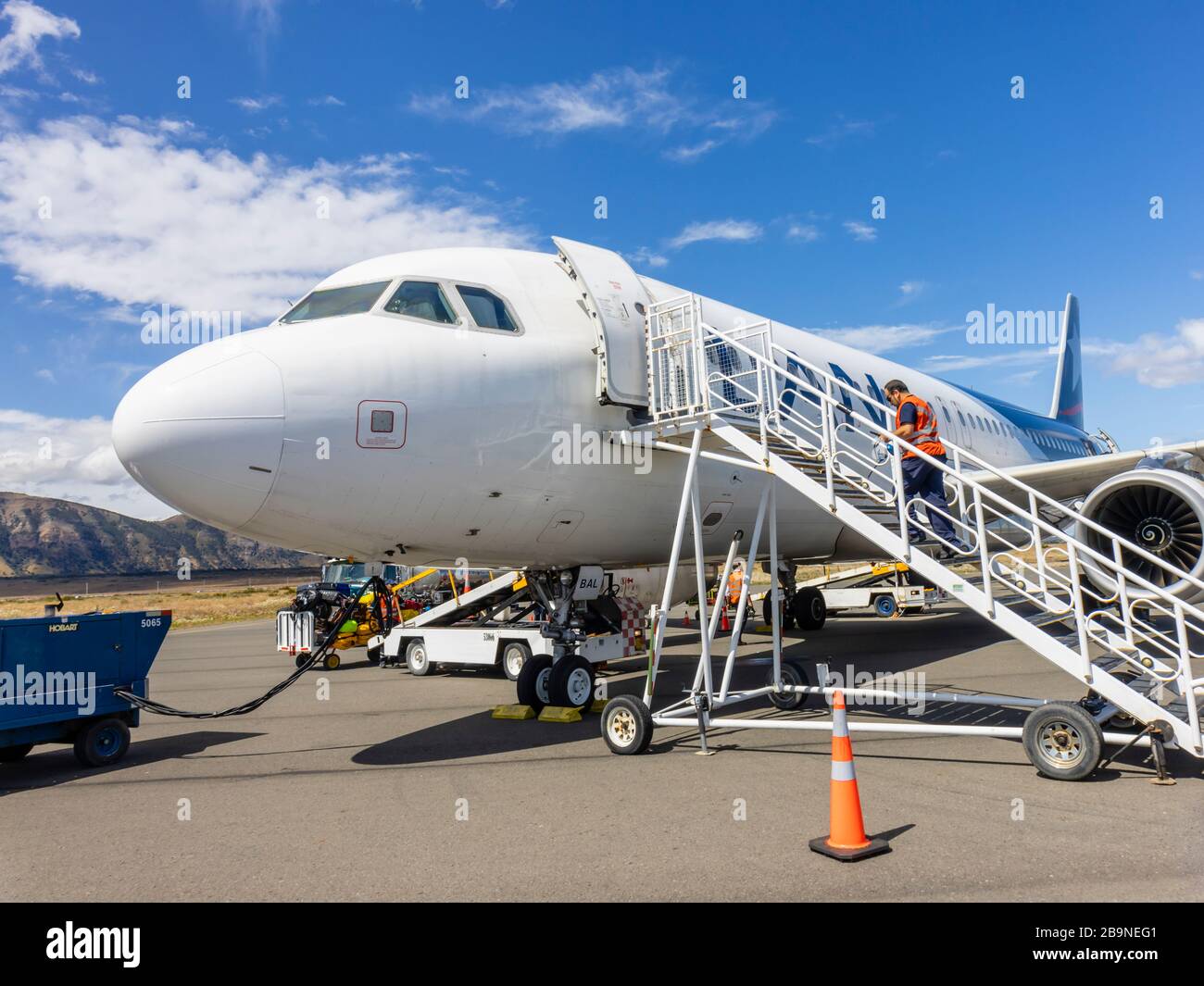 LAN (LATAM Airlines) aircraft on the runway at Teniente Julio Gallardo Airport serving Puerto Natales, Magallanes Region of Patagonia, southern Chile Stock Photo