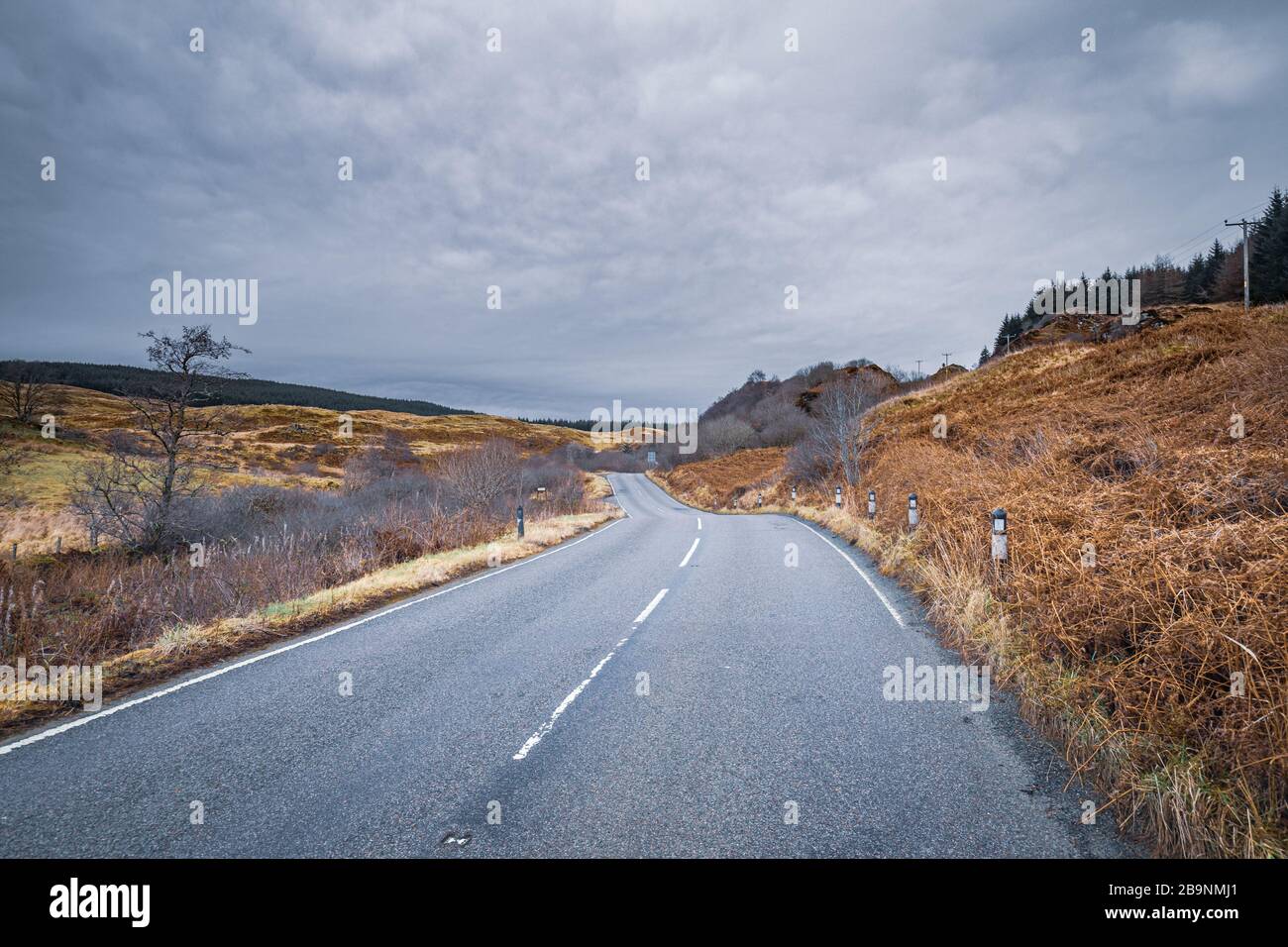 Scenic asphalt road across wild landscape of teh West Coast of Scotland Stock Photo